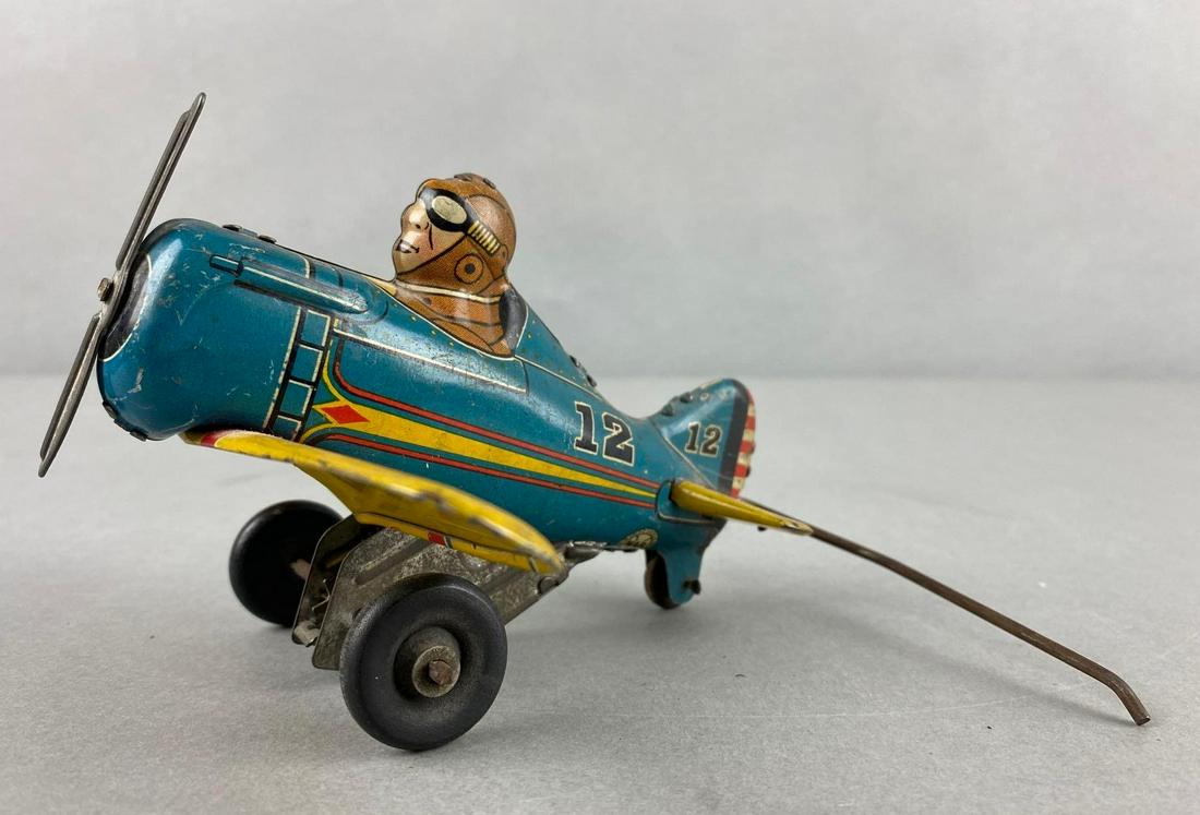 Marx Rollover Wind Up Tin Litho Airplane: Working condition when held, but does not flip on flat surface. 4 x 5 x 7 inches