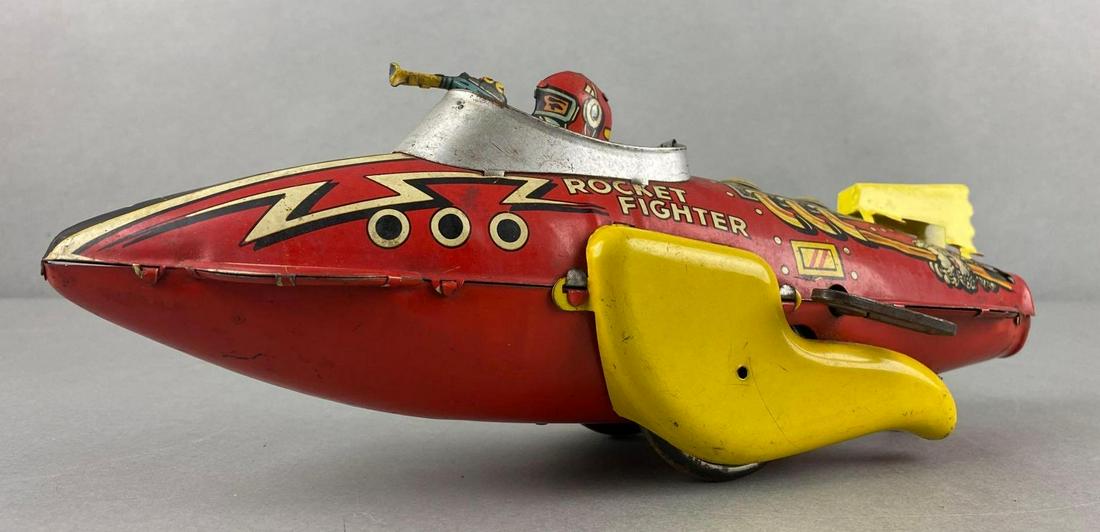 Marx Rocket Fighter Wind Up Tin Litho Airplane: Working condition when held, but not when on flat surface. 5 x 12 x 4 inches