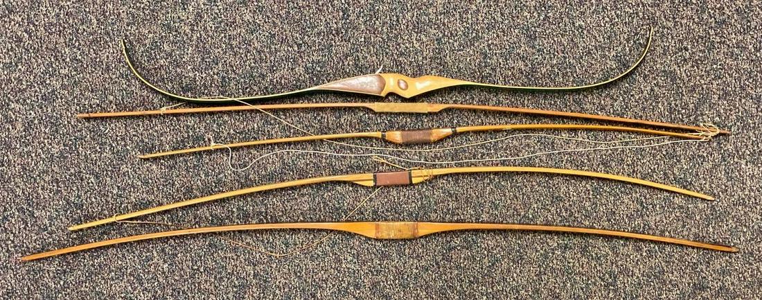 Group of 5 Wood Archery Longbows: Largest measures 67 inches long. Needs restringed