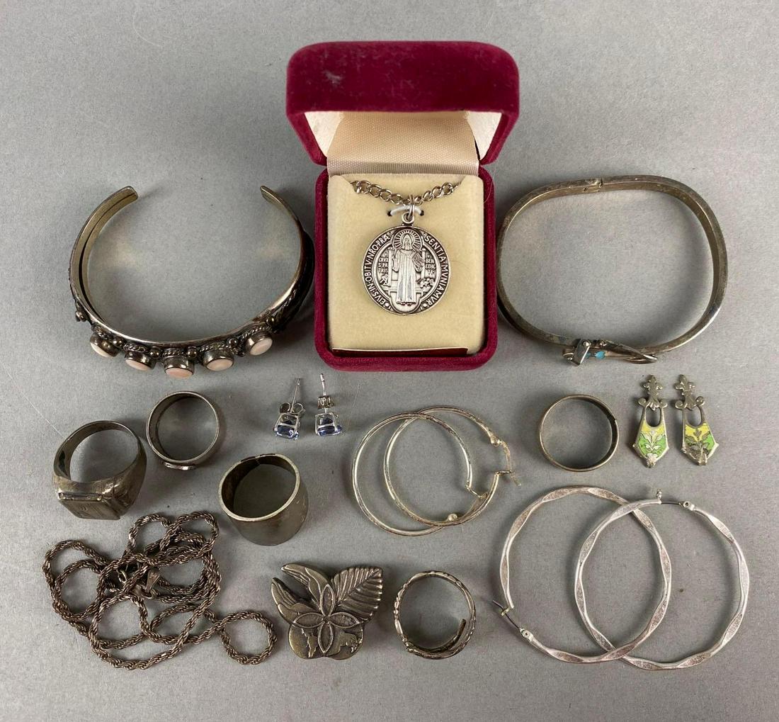 Group of Assorted Jewelry: includes bracelets, rings, earrings and necklaces. largest measures 2 3/4 X 2 1/4 X 1/2 inches