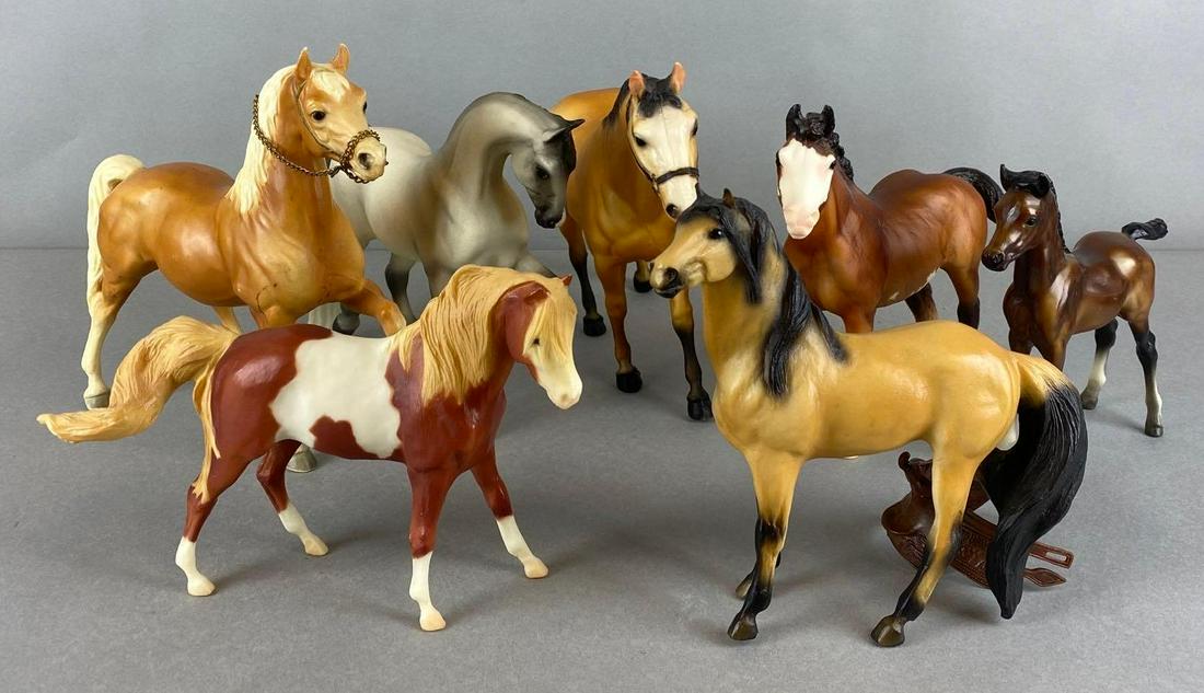 Group of 7 Breyer Horses: Includes 1 saddle, Spirits leg is cracked off, largest measures 8 X 10 1/2 X 2 1/2 inches
