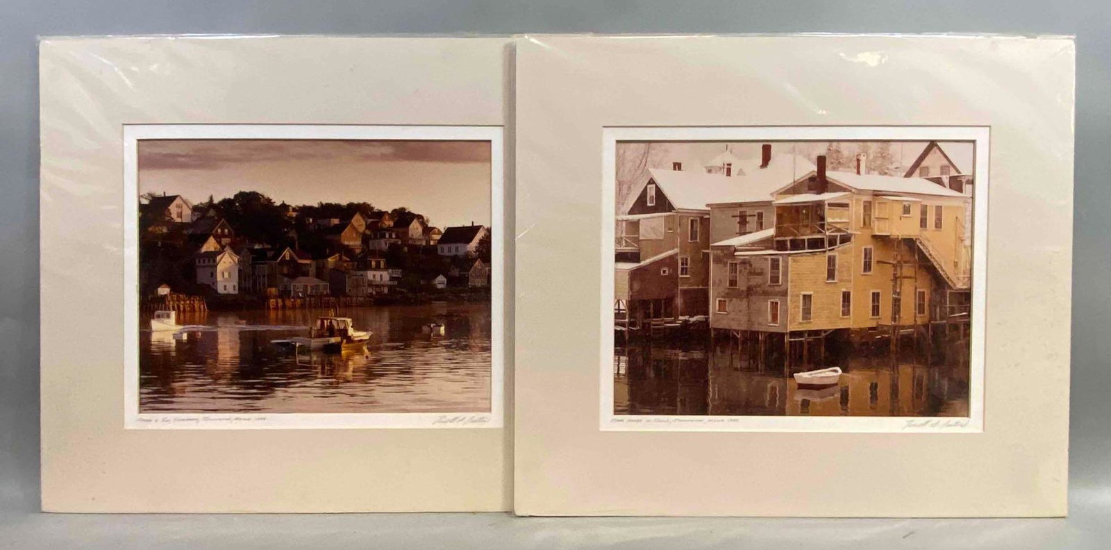 Group of 2 1988 Terrell S. Lester Photographs: Includes Shore Houses in Snow, and Father and Son Fishermen, Artist signature on bottom right corners, Mounted to matte backing, Matte measures 18 x 21in, Photographs measure 12 x 14 1/2in.