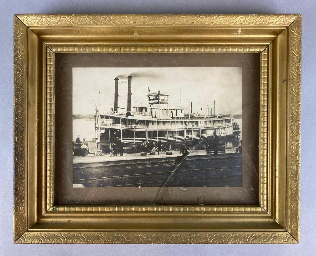 Antique Urania Steamboat Photograph: condition consistent with age, glass in frame cracked, frame measures 12 1/4 X 15 1/4 inches, photo measures 6 3/4 X 9 1/2 inches