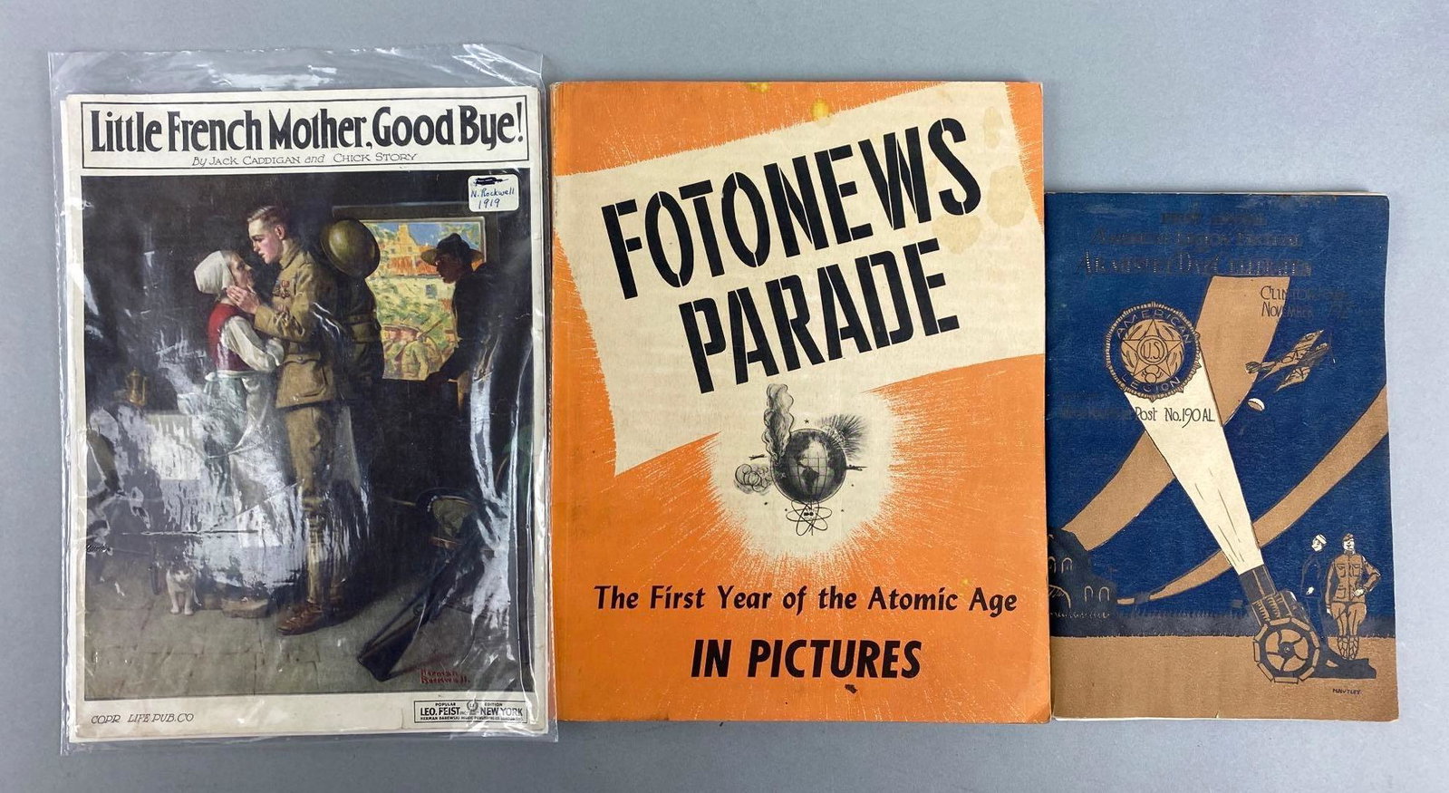 Group of 3 Military Ephemera: Includes Little French another Goodbye Sheet Music, Fotonews Parade in Pictures, and First Annual American Legion Festival and Armistice Day Celebration. Largest measures 11 x 8 inches