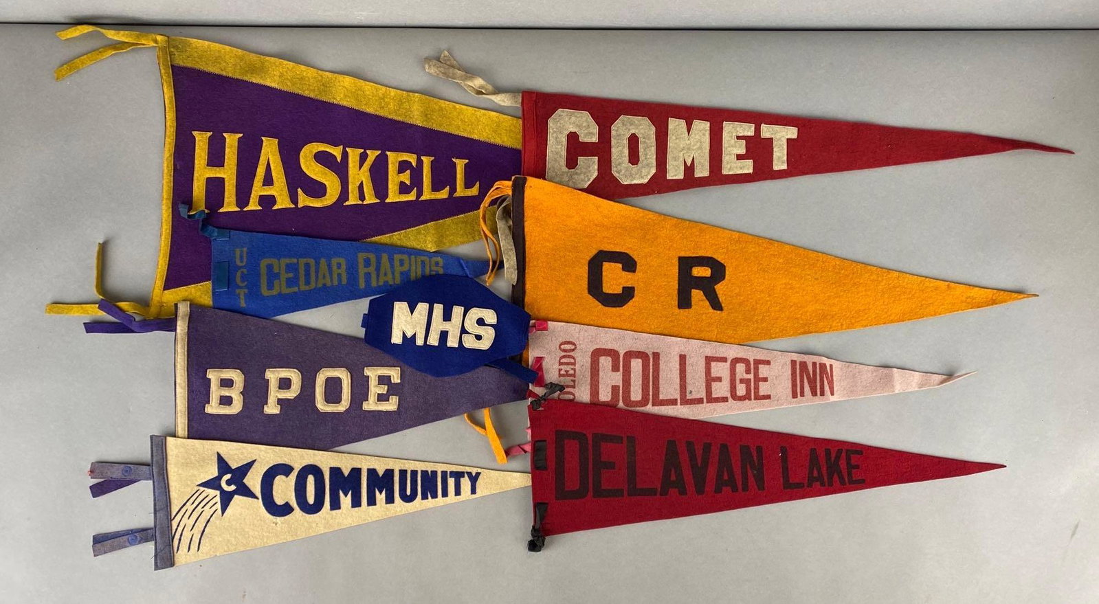 Group of 9 Felt Pennants and More: Includes Haskell, Comet, CR, B Poe, Delavan Lake, and more, Largest measures 13 x 31 1/2in.