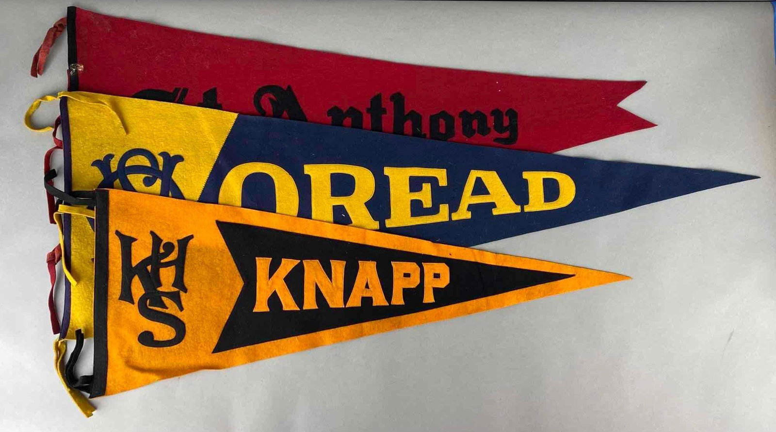 Group of 3 Collegiate Felt Pennants: Includes St. Anthony, Oread, and Knapp, Largest measures 16 x 46in without tassels.