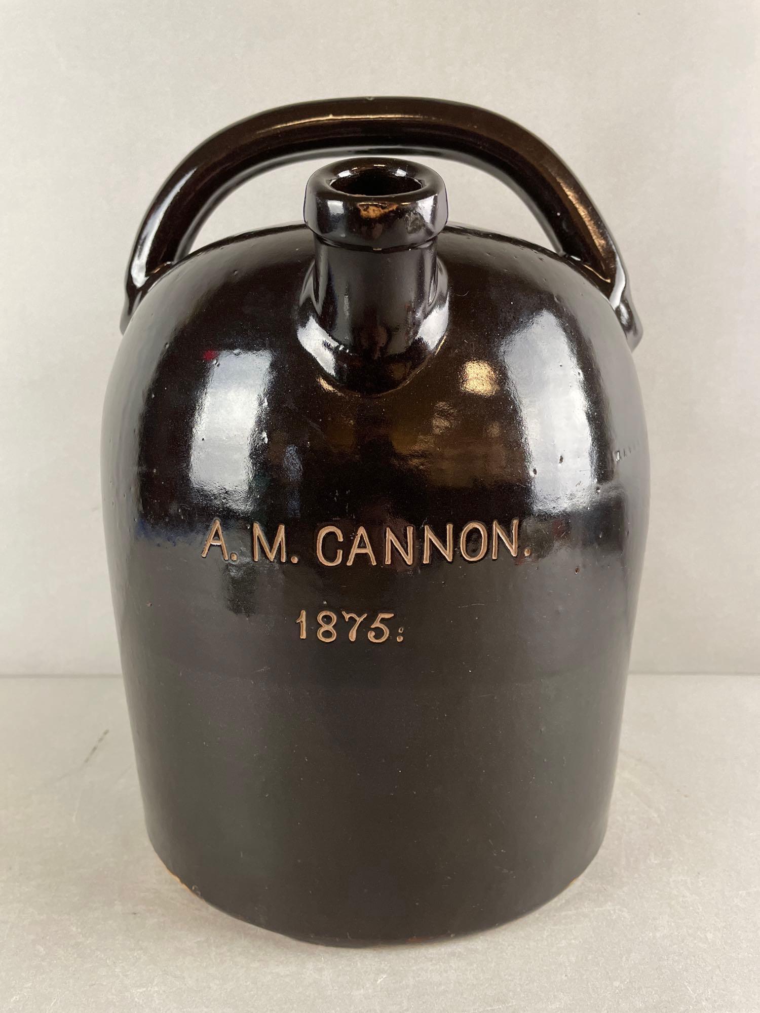 Rare W.J. and E.G. Schrop Springfield Ohio Double Spouted Jug: Albany brown slip A.M. Cannon 1875. One spout has been repaired/ remade. measures 13 x 10 inches