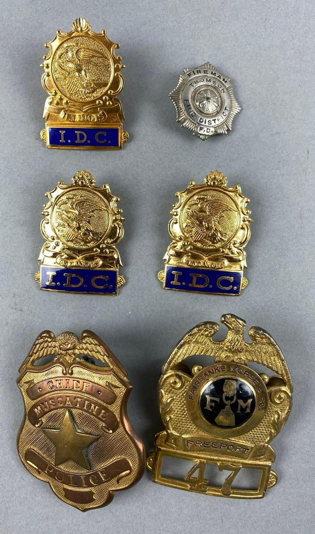 Group of 6 Police and Corrections Badges: Includes Chief Muscatine Police, Fairbanks Morse Freeport, IDC, and more. Largest measures 3 x 2 1/4 inches