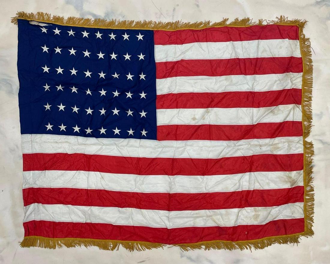 48 Star U.S. Silk Flag: A few holes. Measures 52 1/2 x 66 inches