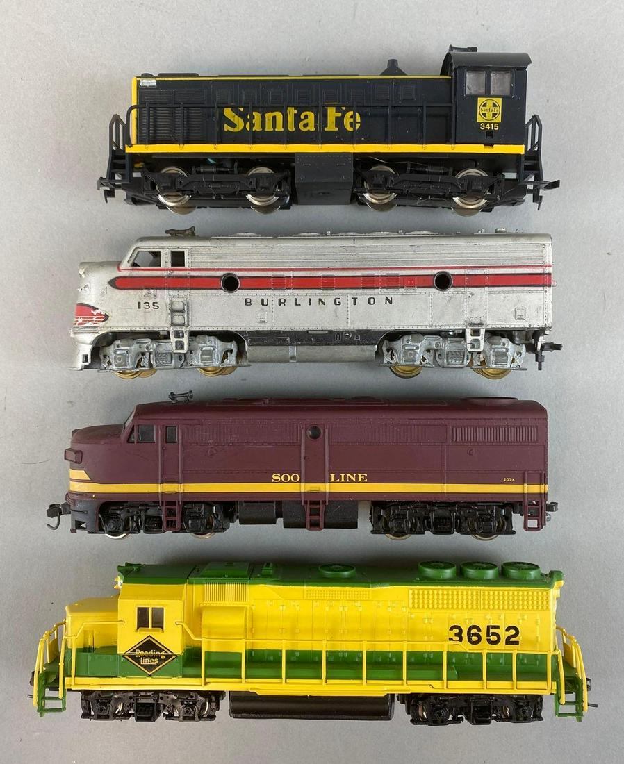 Group of 4 HO Scale Diesel Locomotives: Untested, Includes Bachmann No. 3652, Bachmann No. 207A, Burlington No. 135, and Santa Fe No. 3415, One with original box, Longest measures 8in long.