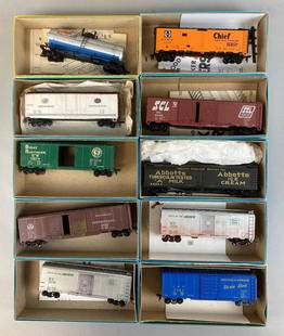 Group of 10 HO Scale Train Cars: Includes Great Northern, Rock Island, Louisville and Nashville Dixie Line, Not original boxes, Longest train car measures 7in long.