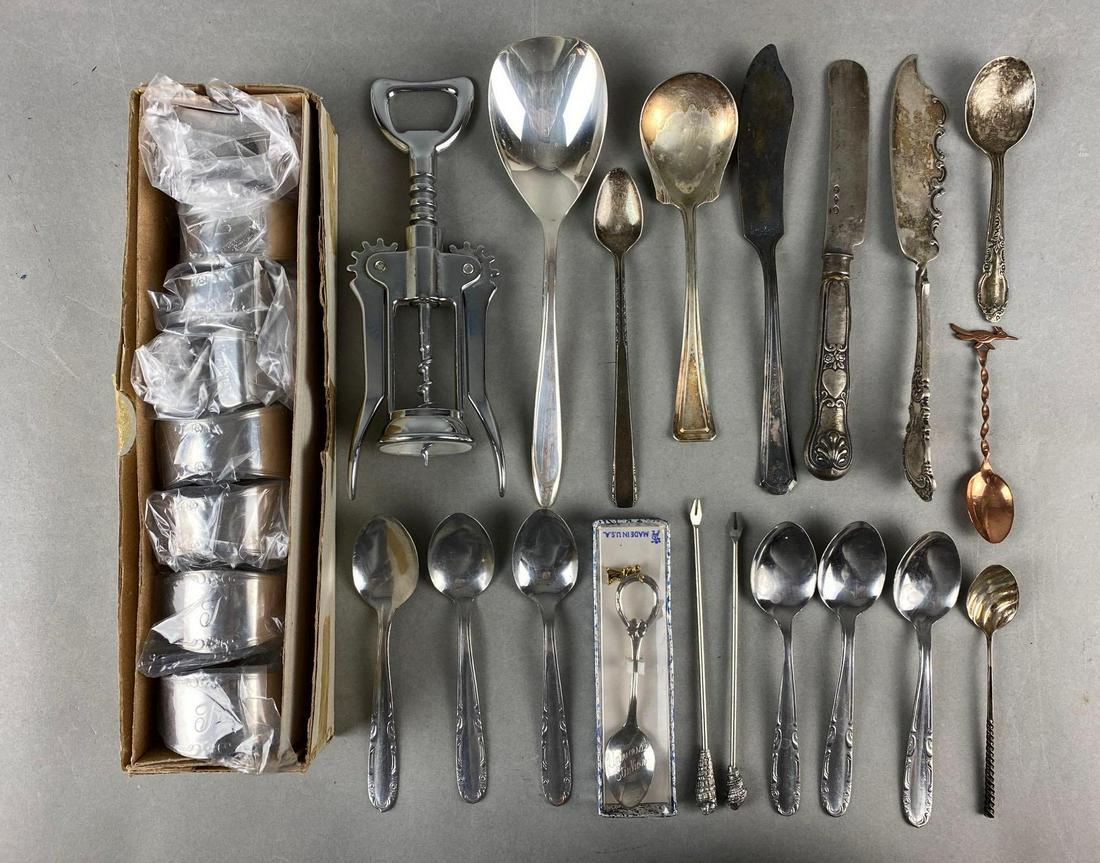 Group of Flatware: Includes spoons, knives, corkscrew, napkin holders and pickle/relish forks. Largest measures 7 3/4 X 2 inches