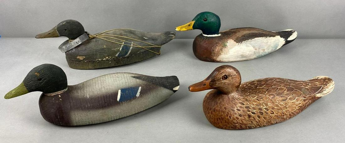 Group of 4 Wood Duck Decoys: Includes makers mark K-Booton, Victor. Largest measures 6 1/2 x 16 x 5 inches