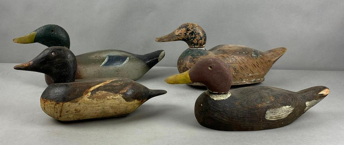 Group of 4 Wood Duck Decoys: largest measures 8 x 16 1/2 x 5 1/2 inches