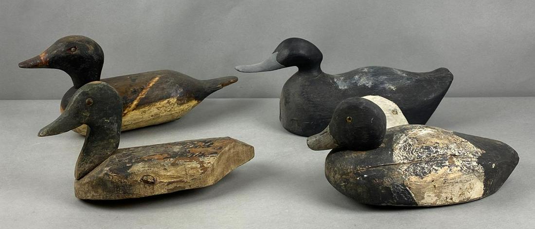 Group of 4 Wood Duck Decoys: Largest measures 7 x 15 x 5 inches