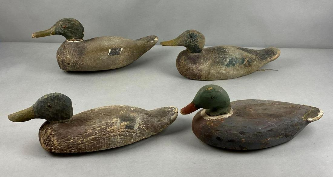 Group of 4 Wood Duck Decoys: Largest measures 8 1/2 x 16 x 5 inches
