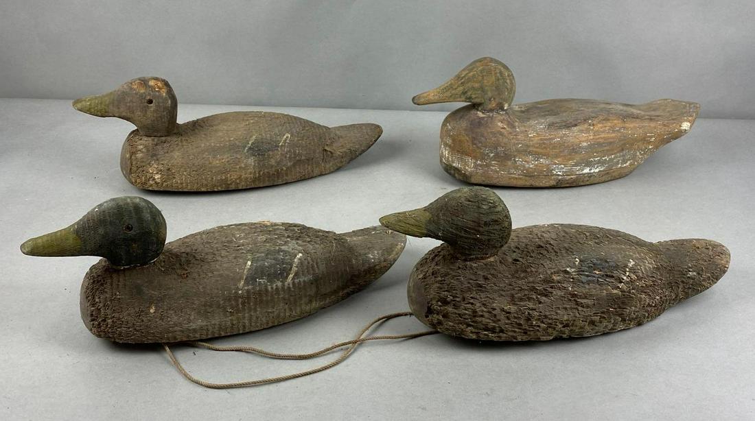 Group of 4 Wood Duck Decoys: Largest measures 7 1/2 x 16 x 4 inches