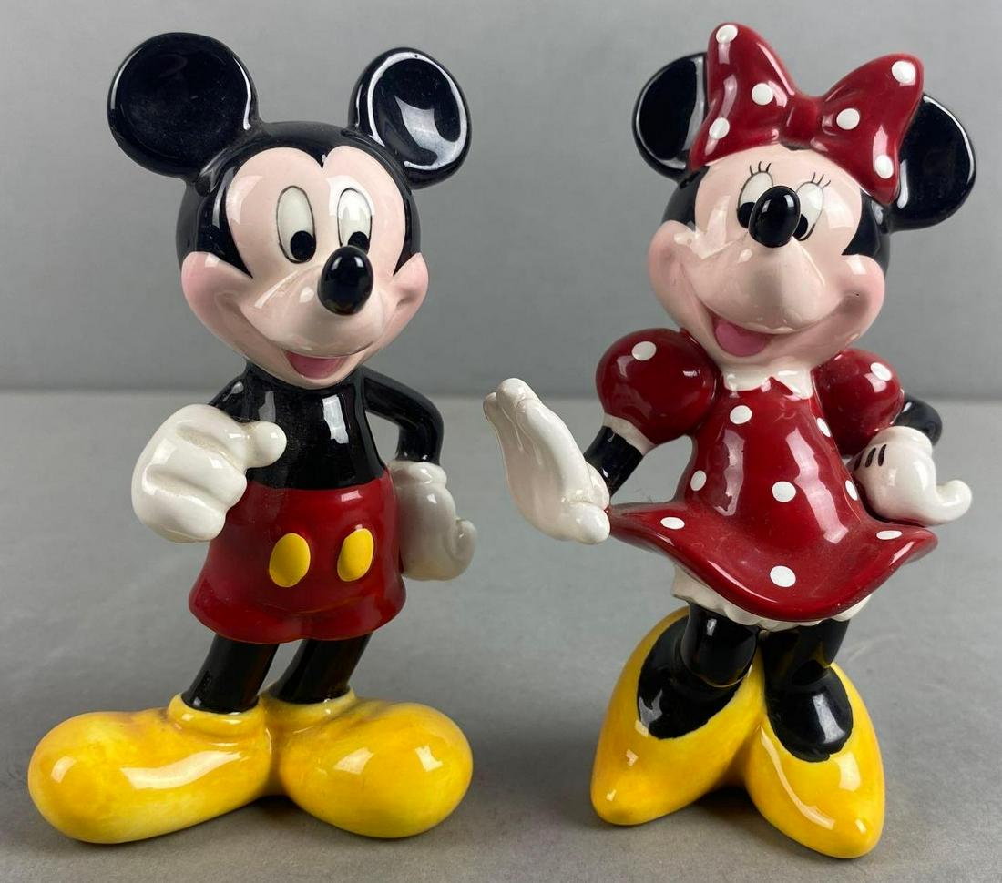 Group of 2 Disney Mickey and Minnie Mouse Porcelain Figures: Largest measures 4 x 2 1/2 x 1 1/4 inches. Marked Malaysia