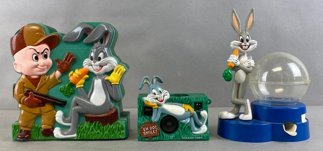 Group of 3 Looney Tunes Bugs Bunny Items: 1970s, Includes Coin Bank, Camera, and Gumball machine, Untested, Coin bank with piece of top broken off, Largest measures for 8 x 8 x 3in.