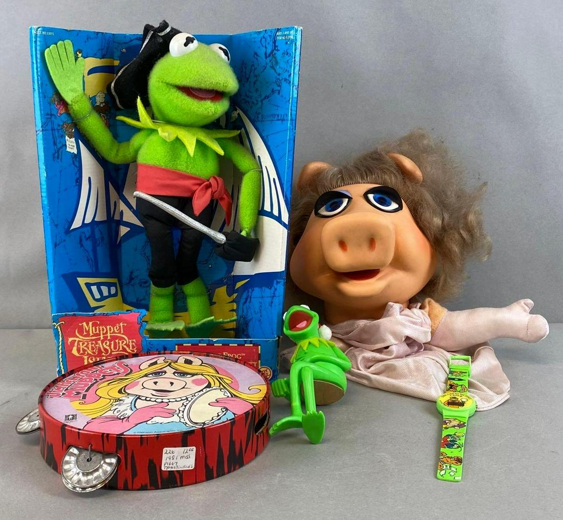Group of 5 Assorted Muppets Items: Includes Muppet Treasure Island Plush, Miss Piggy Puppet, Tambourine, Watch, and more, Largest measures 12 3/4 x 9 x 4in.