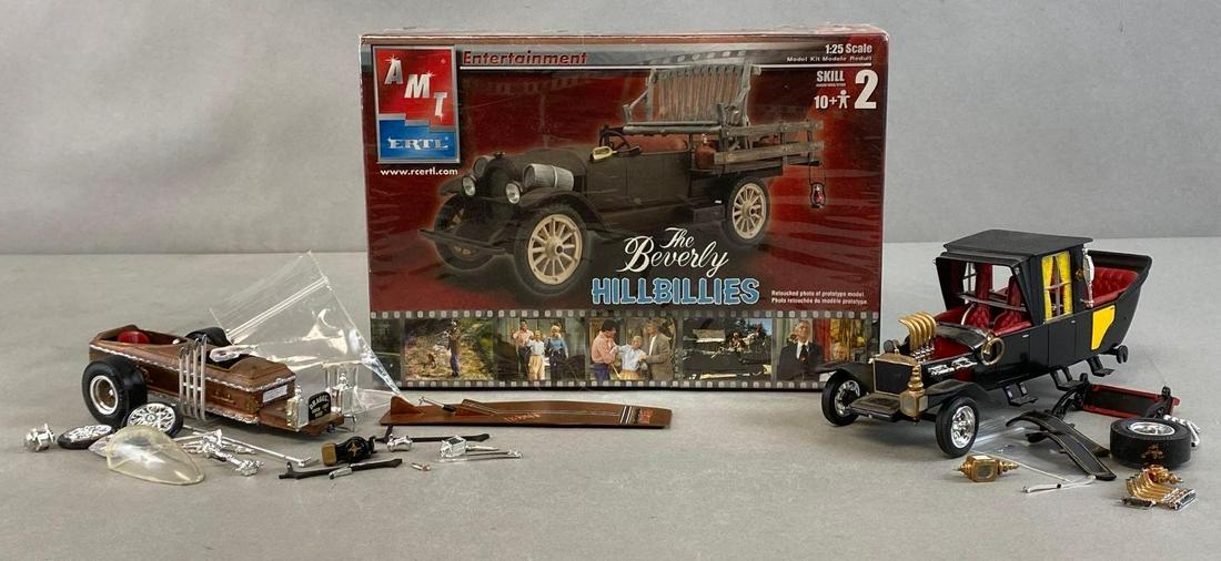 Group of 3 Classic TV Show Model Cars and Kits: Includes The Beverly Hillbillies, Dracula, and The Munsters, Some broken and missing pieces, Beverly Hillbillies factory sealed, Box measures 6 1/2 x 9 1/4 x 4in.