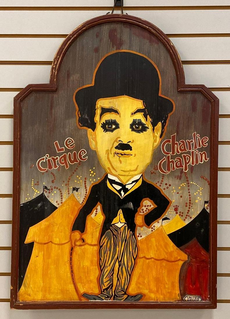 Charlie Chaplin Le Cirque Promotional Sign: A French promotional sign for the Charlie Chaplin film Le Cirque (United Artists, 1928). The sign is painted on wood with a stylized image of Chaplin based on the U.S. film poster. The sign reads, "Le