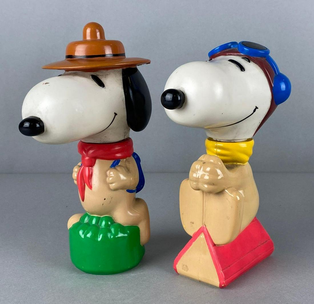 Group of 2 Peanuts Snoopy Shampoo Bottles: Includes Beagle Scout Snoopy, and Flying Ace Snoopy, Empty bottles, Tallest measures 9 1/2 x 3 1/2 x 5in.