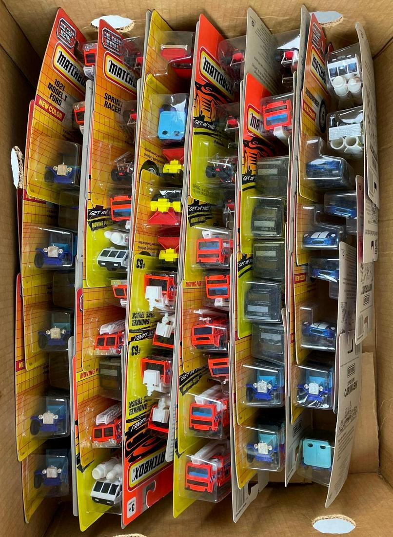 Group of 57 Assorted Matchbox Diecast Vehicles: Original packaging, many duplicates. Each measure 6 1/2 x 4 inches