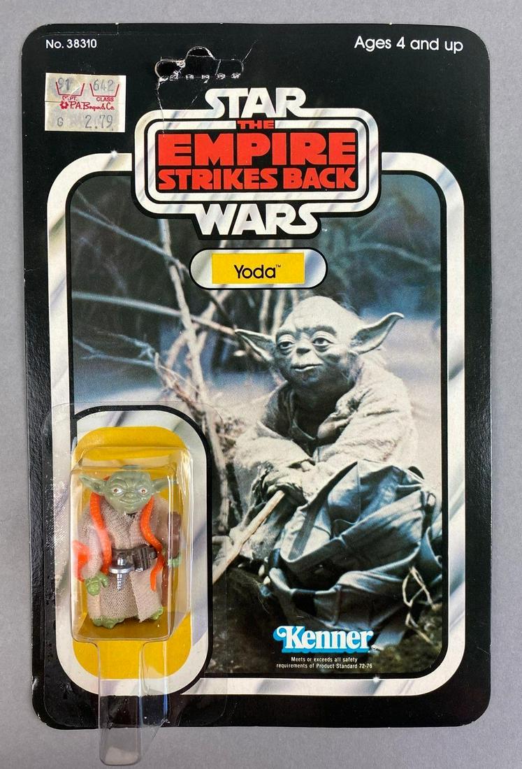 Kenner Star Wars The Empire Strikes Back Yoda Action Figure: 1977, punched. Packaging measures 9 x 6 inches.