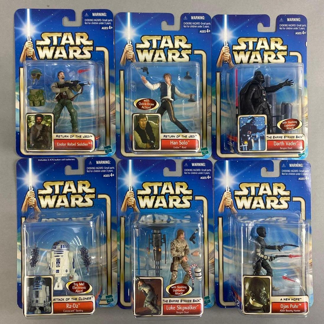 Group of 6 Hasbro Star Wars Action Figures: Includes R2-D2, Luke Skywalker, Darth Vader, and more. Packaging measures 9 x 6 inches
