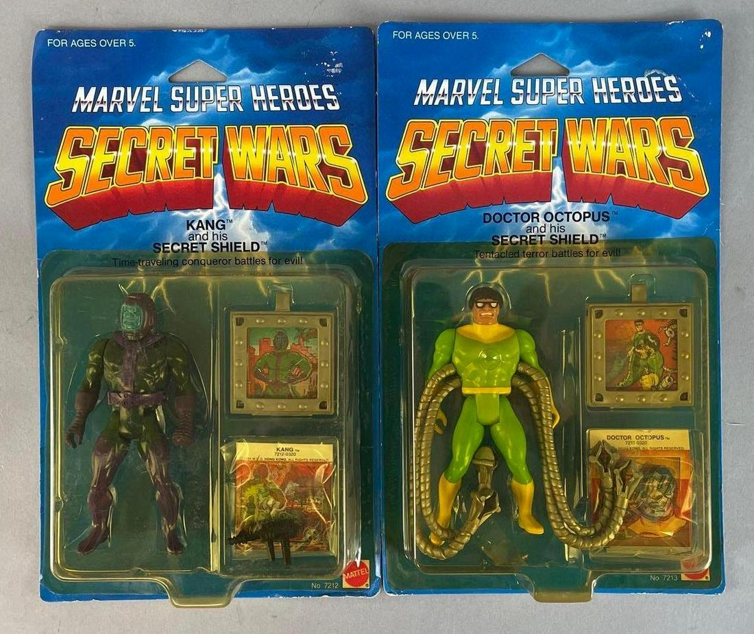 Group of 2 Mattel Marvel Super Heroes Secret Wars Action Figures: 1984 original packaging, includes Kang and Doctor Octopus. Each measure 10 x 6 inches