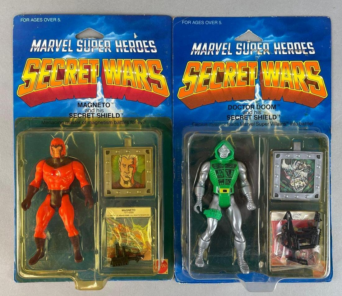 Group of 2 Mattel Marvel Super Heroes Secret Wars Action Figures: 1984 original packaging, includes Magneto, and Doctor Doom. Each measure 10 x 6 inches