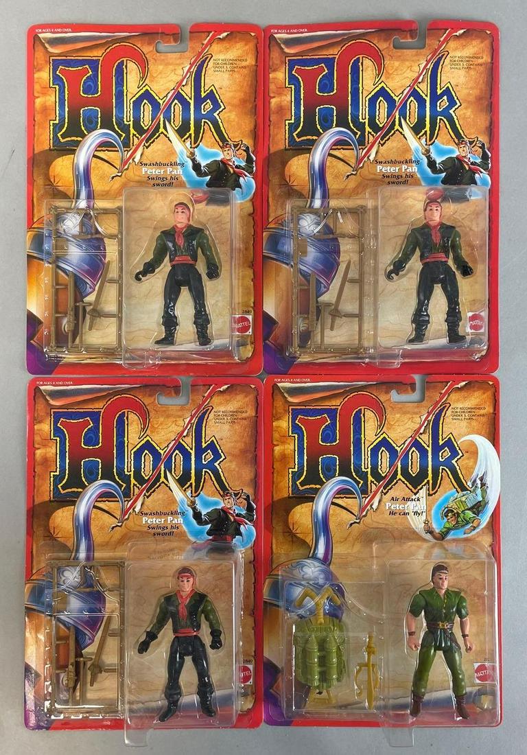 Group of 4 Mattel Hook Peter Pan Action Figures: 1991 original packaging, includes 3 swashbuckling, and one air attack. Each measure 11 x 7 1/2 inches