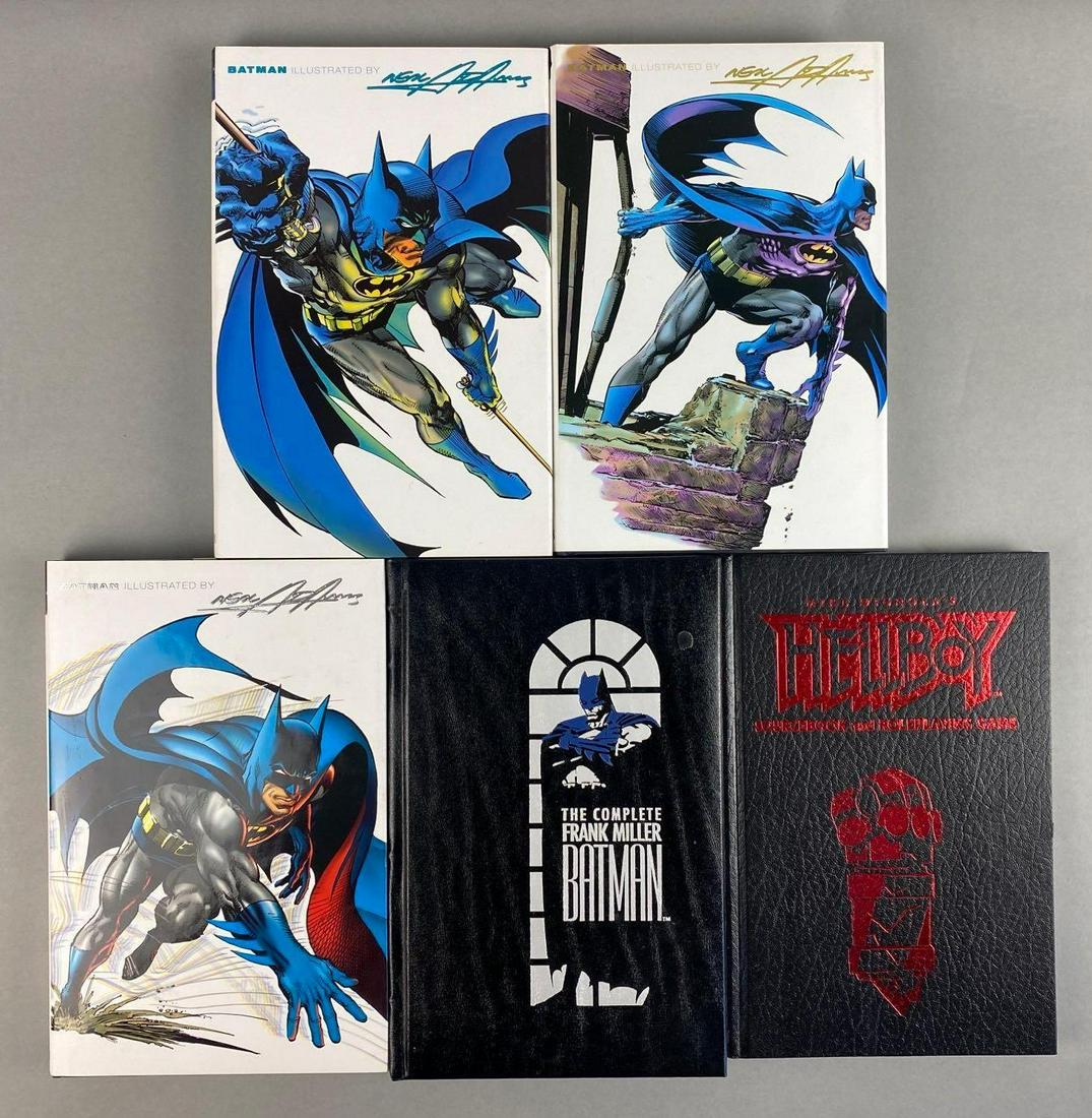Group of 5 Batman and Hellboy Books: includes Batman illustrated, The complete Frank Miller Batman, Hellboy sourcebook and role playing game, and more. Largest measures 10 1/2 x 7 x 1 inches
