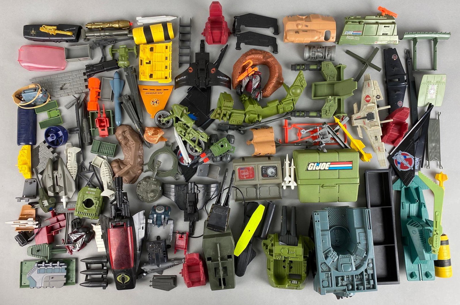 Group of Miscellaneous G.I. Joe Vehicle Parts and Weapons: Circa 1980s, for 3 3/4 inch figures, in used condition - parts missing and cracked, largest measures 6 3/4 X 4 1/4 X 2 3/4 inches