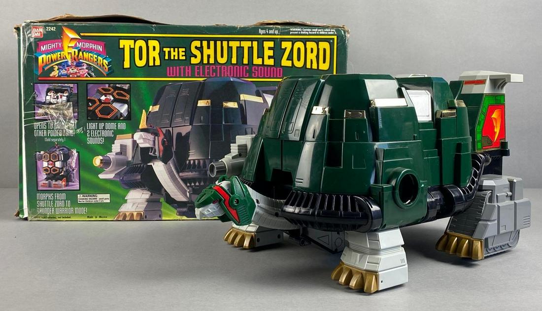 1994 Bandai Tor the Shuttle Zord: No. 2242, untested. Spring in battery slot is bent. For measures 9 x 17 x 10 1/2 inches. Original box, worn condition. Unknown set completion, missing one blaster.