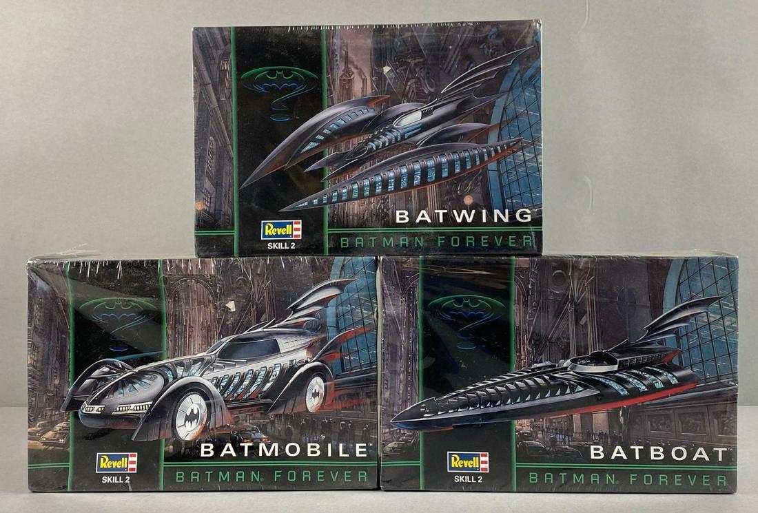 Group of 3 Revell Batman Vehicle Kits: Includes Batwing, Batmobile, and Batboat. All sealed. Largest packaging measures 7 1/2 x 11 x 4 inches. 1/25 and 1/32 scale