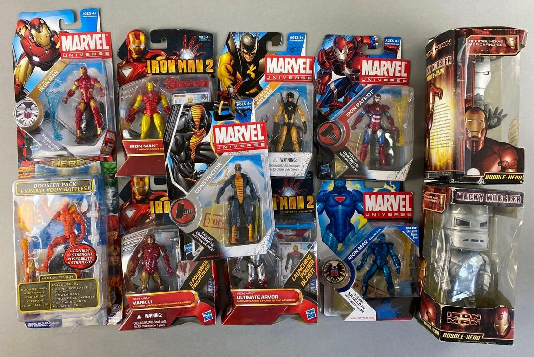 Group of 11 Assorted Marvel Action Figures: Includes Funko Iron Man Bobblehead, Human Torch, constrictor, and more. Largest packaging measures 7 1/4 x 4 x 3 1/2 inches