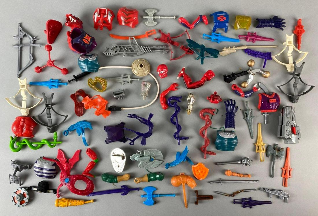 Group of Assorted He-ManAction Figure Accessories and More: 1980s, Masters of the Universe, Includes Swords, armor, limbs, and more, Largest measures 4 x 4 x 1in.