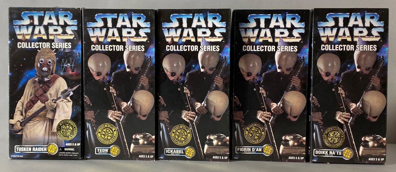 Group of 5 Kenner Star Wars Action Figures: 1996, Includes Tusken Raider, Tedn, Ickabel, Figrin DAn, and Doikk NaTs, In original packaging, Some tape on top of boxes, Boxes measure 13 x 6 1/2 x 2 1/2in, Figures measure 12 1/2in tall.