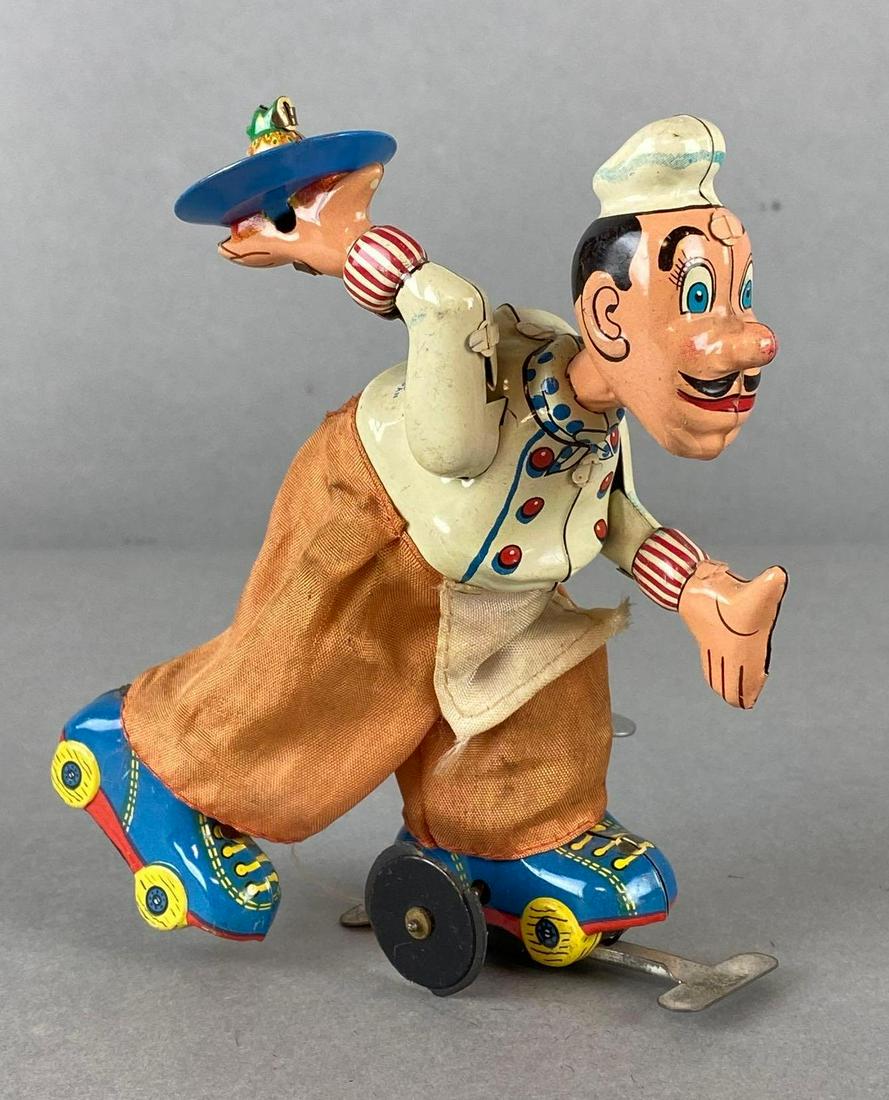 T.PS. Tin Litho Wind Up Rollerskating Cook (1 of 8)