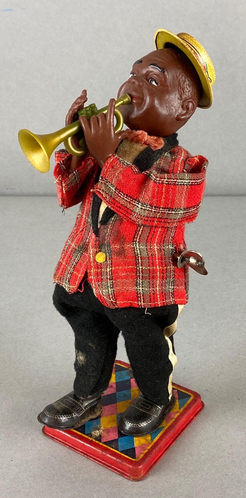 T.N. Louis Armstrong Stachmo Wind Up Toy: Working condition, Some stains throughout, Made in Japan, Measures 10 x 4 x 4in.
