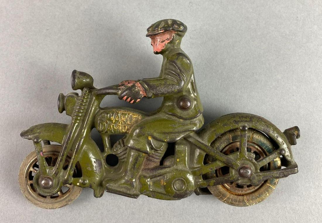 Hubley Cast Iron Harley Davidson Motorcycle with Rider: Unmarked, paint loss, missing part of wheel - other wheel is cracking, measures 6 X 1 3/4 X 4 inches