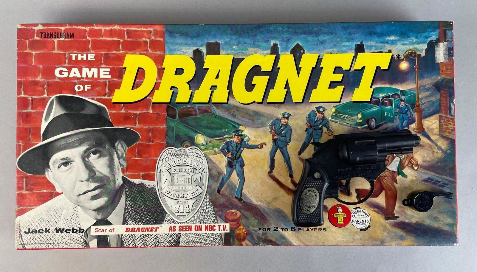 Group of 3 Dragnet Items: Includes knickerbocker squirt gun, whistle, and EMPTY game of dragnet box. Box measures 10 x 19 1/2 x 2 inches