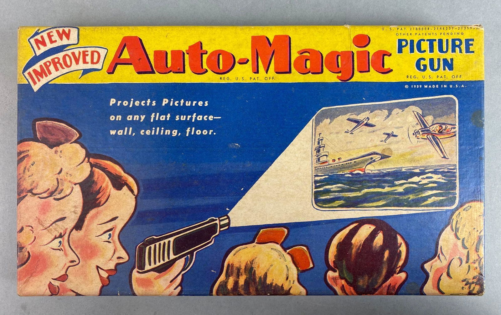 Auto Magic Picture Gun Projector: 1939, made in the U.S.A., unknown working condition, measures 5 3/4 X 3 1/2 X 3/4 inches, with original box, box measures 12 1/2 X 7 1/4 X 1 inches