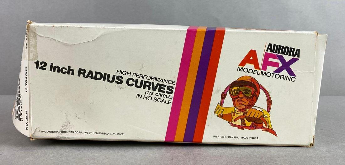 Aurora AGX Snap On Slot Car Track Elevation Supports: with box - not original, circa late 1970s-early 80s, largest piece measures 3 3/4 X 3 1/2 X 1 1/4 inches, box measures 9 1/2 X 4 X 3 1/2 inches