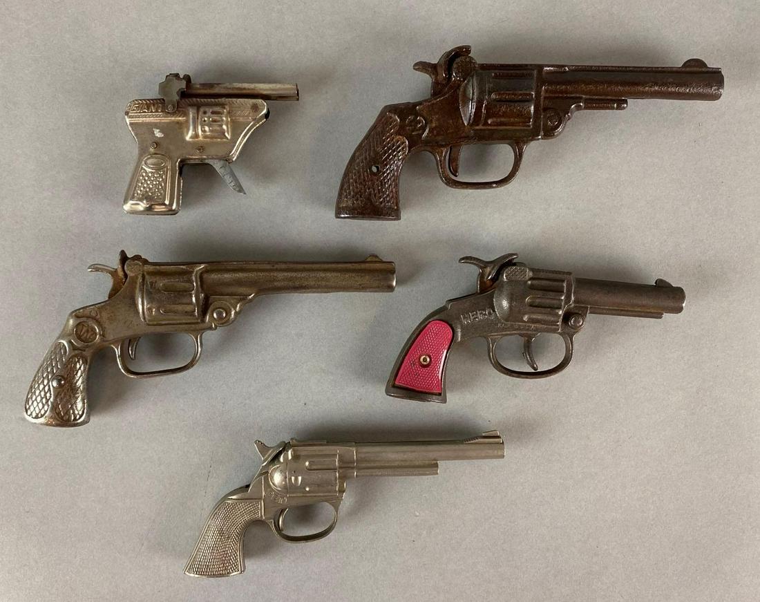 Group of 5 Metal Cap Guns and More: Untested, Includes Hero, Lightning Express, Western, and more, Largest measures 7 x 3 x 1in.