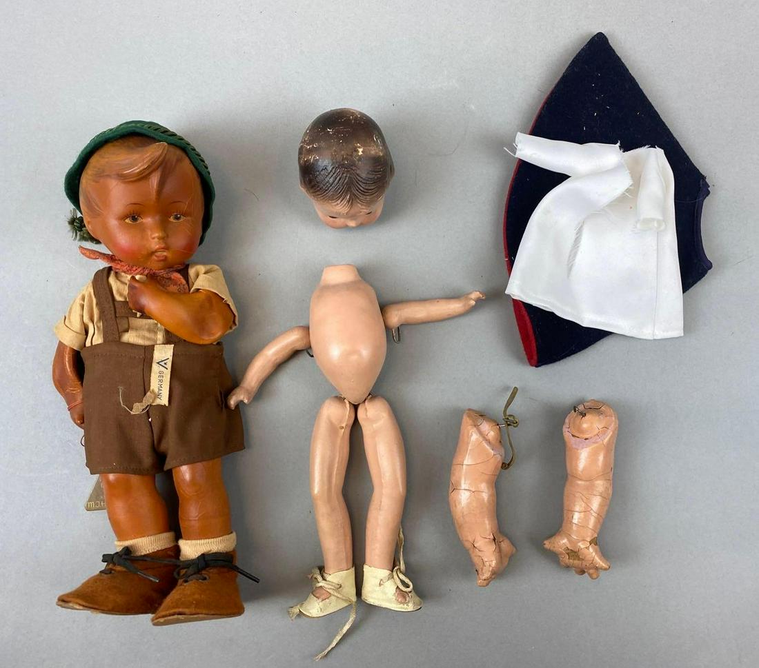 Group of 2 Composite Dolls and Accessories: Includes W Goebel Oeslau Radibur MJ Himmel (arms and flattened), and more. Largest measures 11 inches tall.
