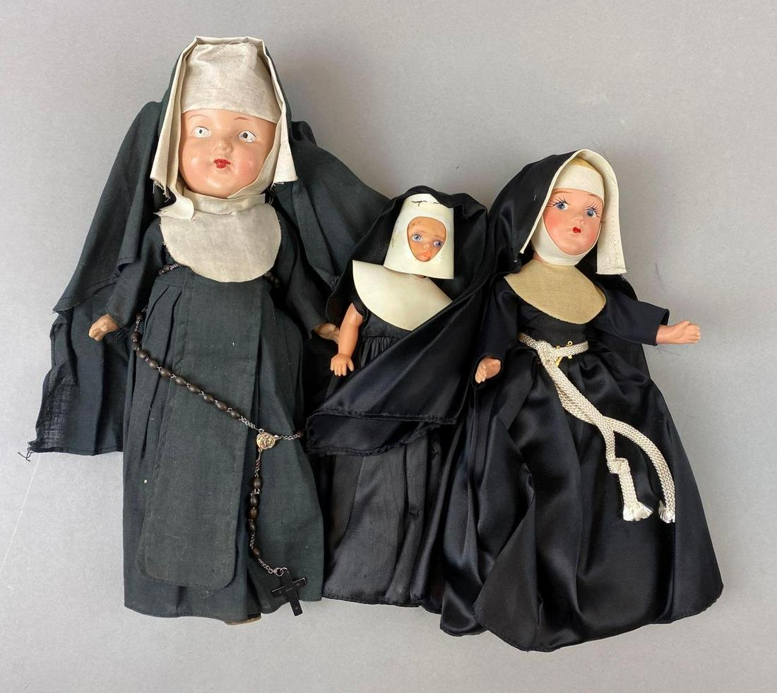 Group of 3 Assorted Nun Dolls: Largest measures 13 inches tall.