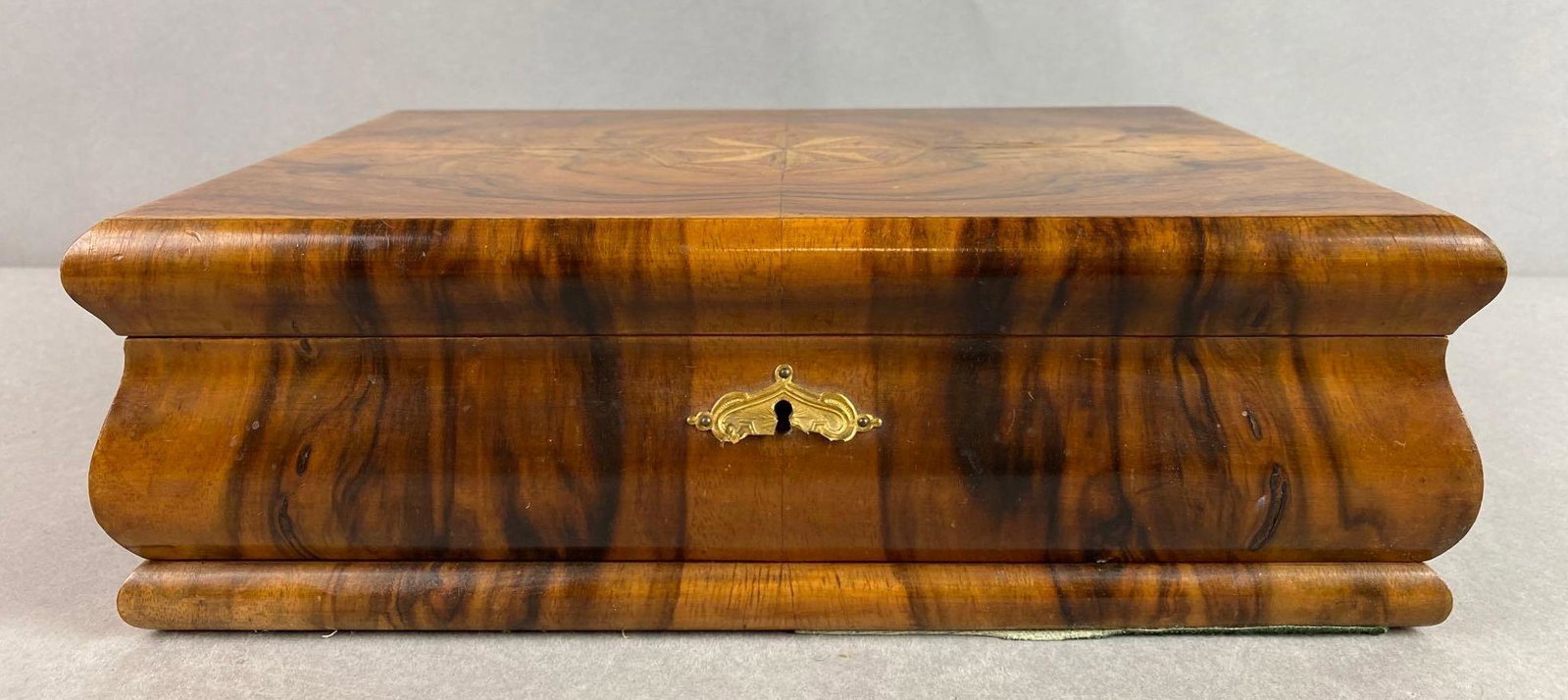 Wood Inlaid Box: No key, part of metal on lock is cracked off, mirror has discoloration, measures 12 1/4 X 8 1/2 X 4 inches